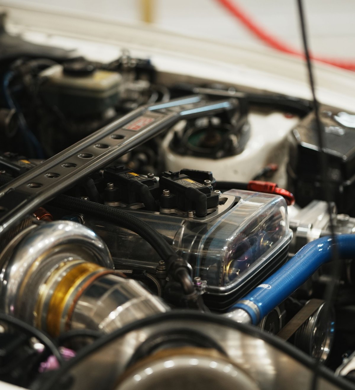 A performance-tuned turbocharged engine bay, representing dyno-verified tuning gains
